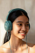 woman wearing aura baby melody headphones listening to baby's heartbeat