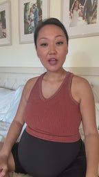 Pregnant woman using Aura Baby Encore Fetal Doppler