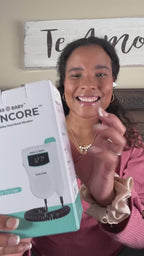 Pregnant woman using Aura Baby Encore Fetal Doppler